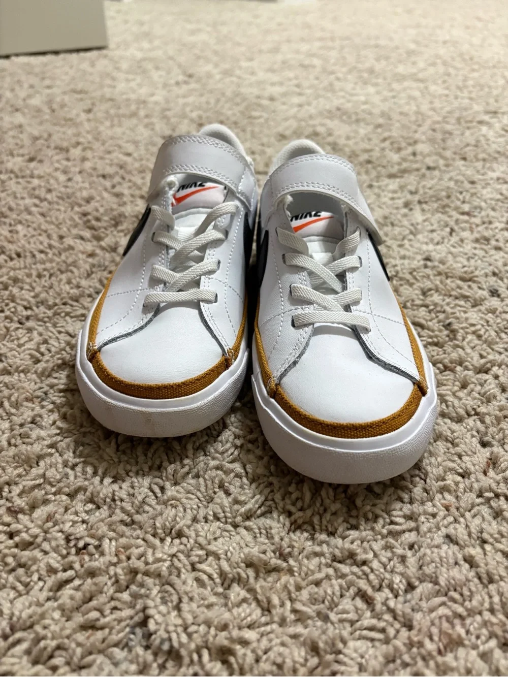 Nike White Sneakers with Black Swoosh and Gold Accent girls size 13 never worn
